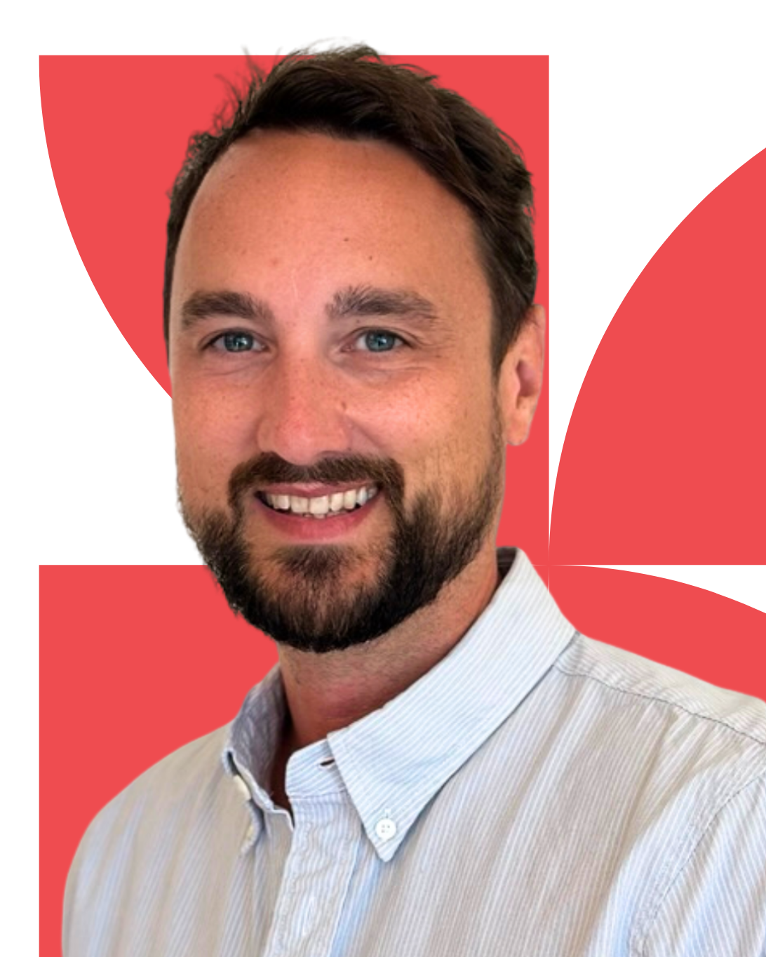 Headshot of man with dark hair and a striped button up shirt in front of a red graphic backdrop