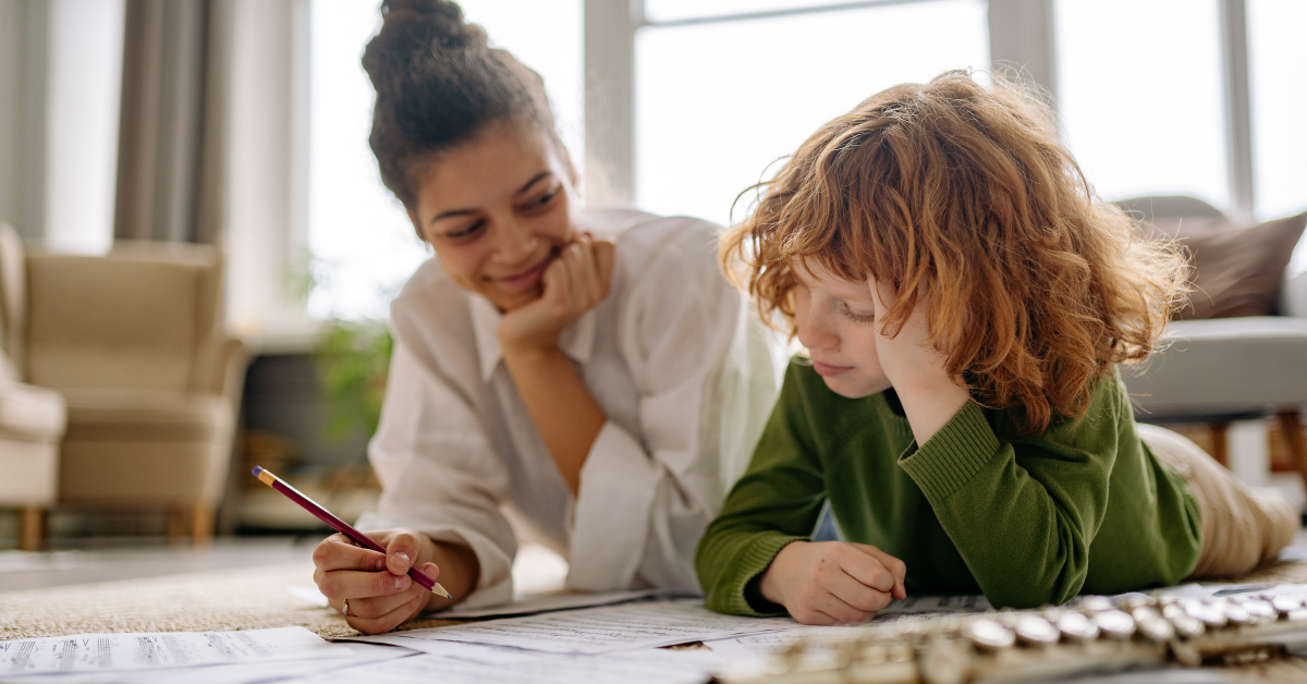 Children's Support Worker doing some homework with a young boy