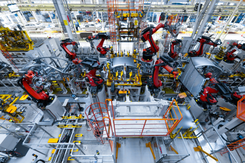 State-of-the-art industrial robots work seamlessly across a fully automated production line, showcasing the future of smart manufacturing and operational excellence.