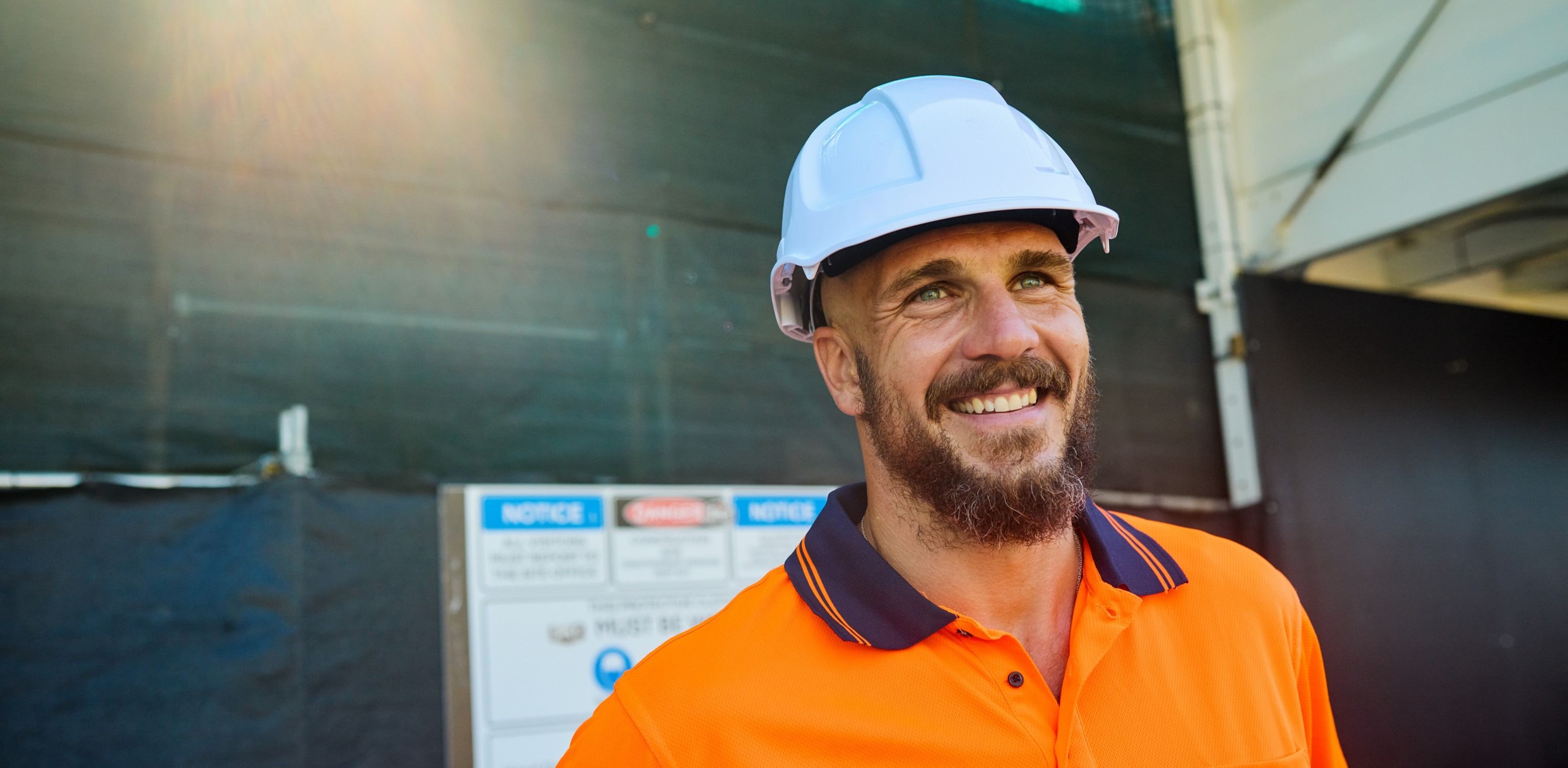 Engineer smiling wearing a hard hat
