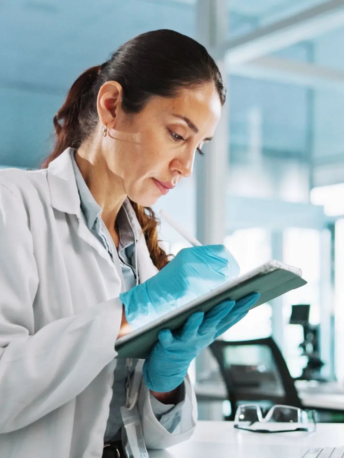 woman scientist on tablet