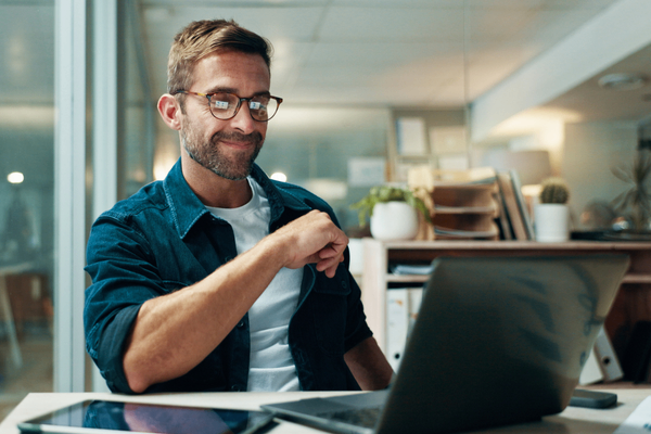 QA professional looking at salary data on laptop