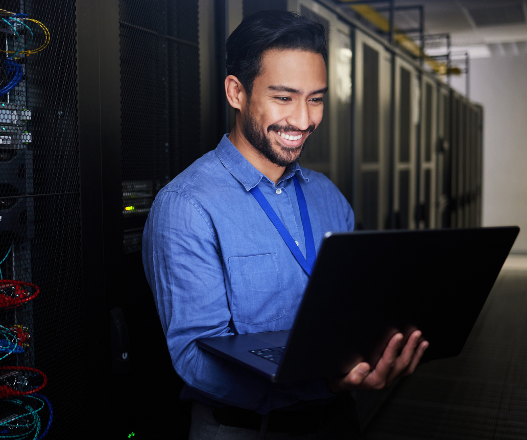IT infrastructure manager looking at salary guide in server room