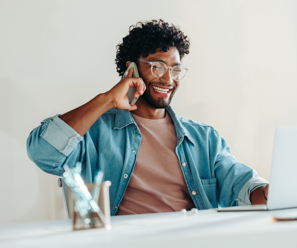 Business development professional on phone looking at salary guide