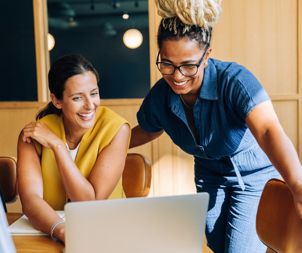 Hiring managers looking at 2026 salary guide on laptop
