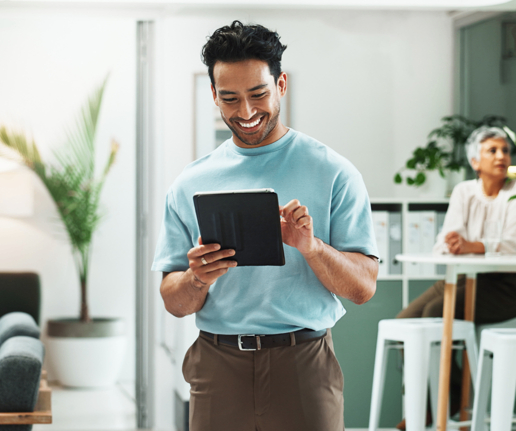 Tech professional looking at 2026 salary data on tablet