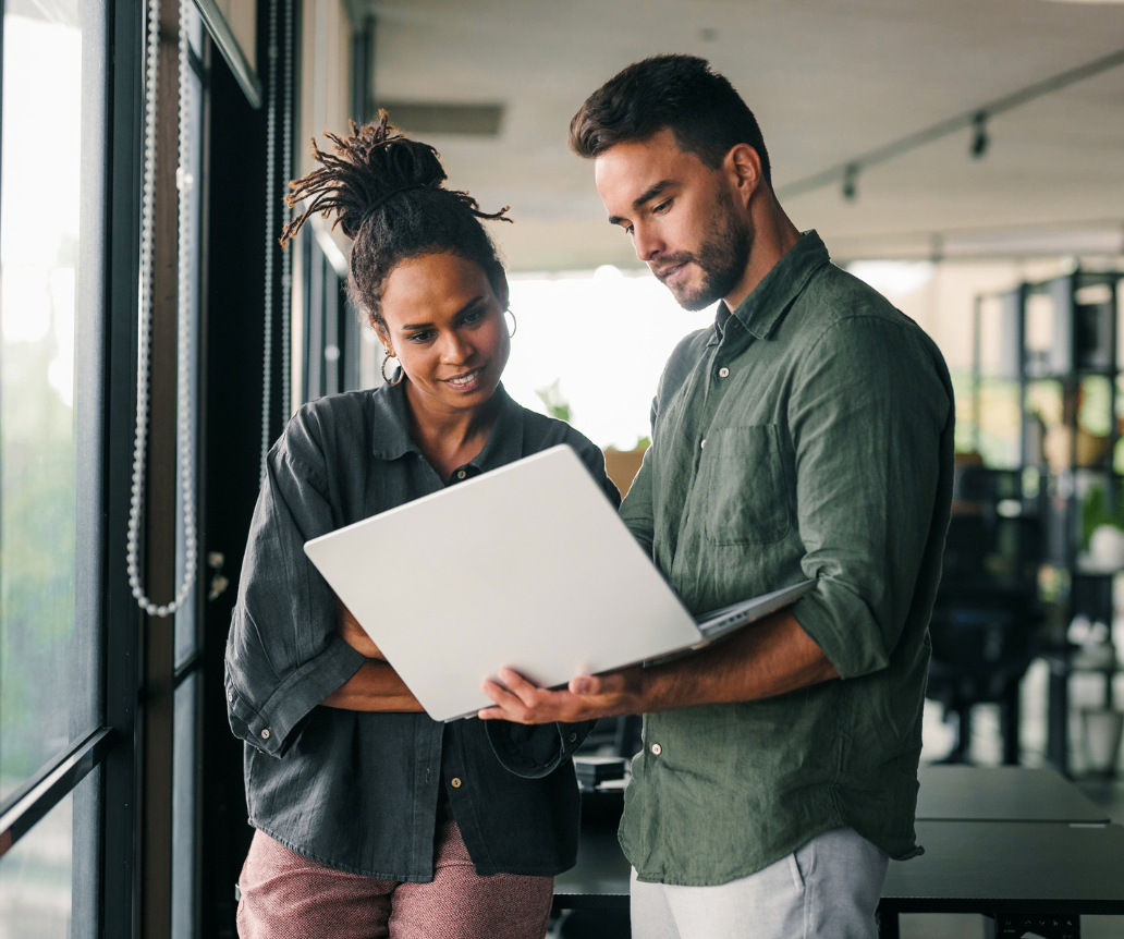 Data professionals discussing 2026 salalry data on laptop