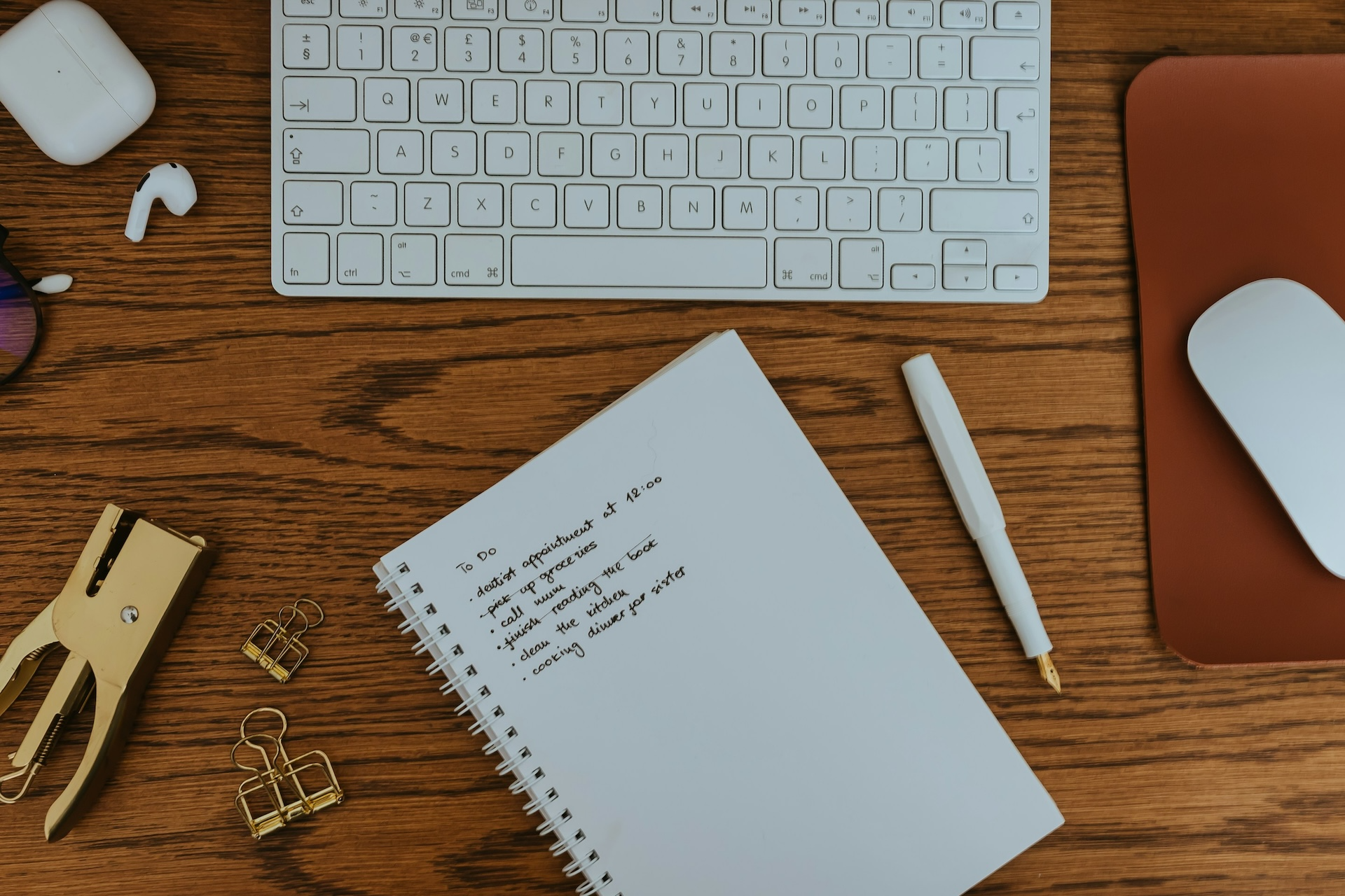 A notebook at a desk with job application notes