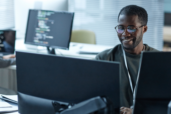 Cyber security professional looking at 2026 salary data on computer
