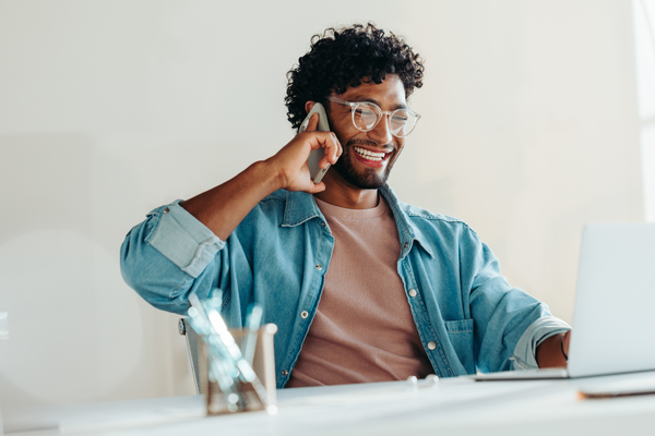 Salesperson on phone discussing 2026 salary data