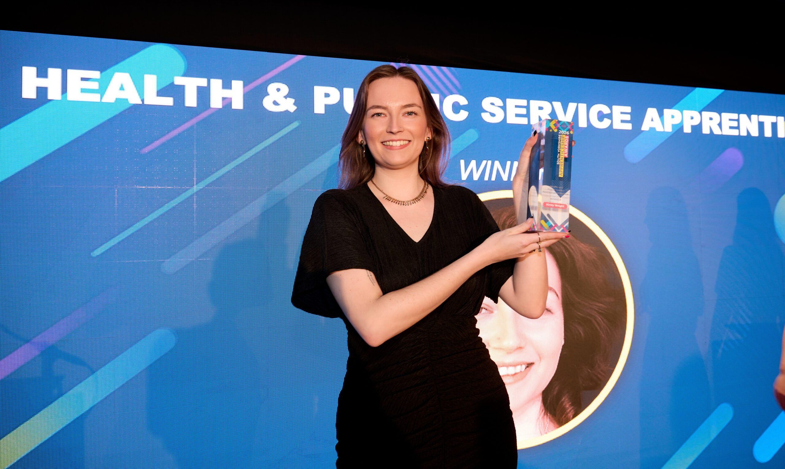 Kirsty holding award