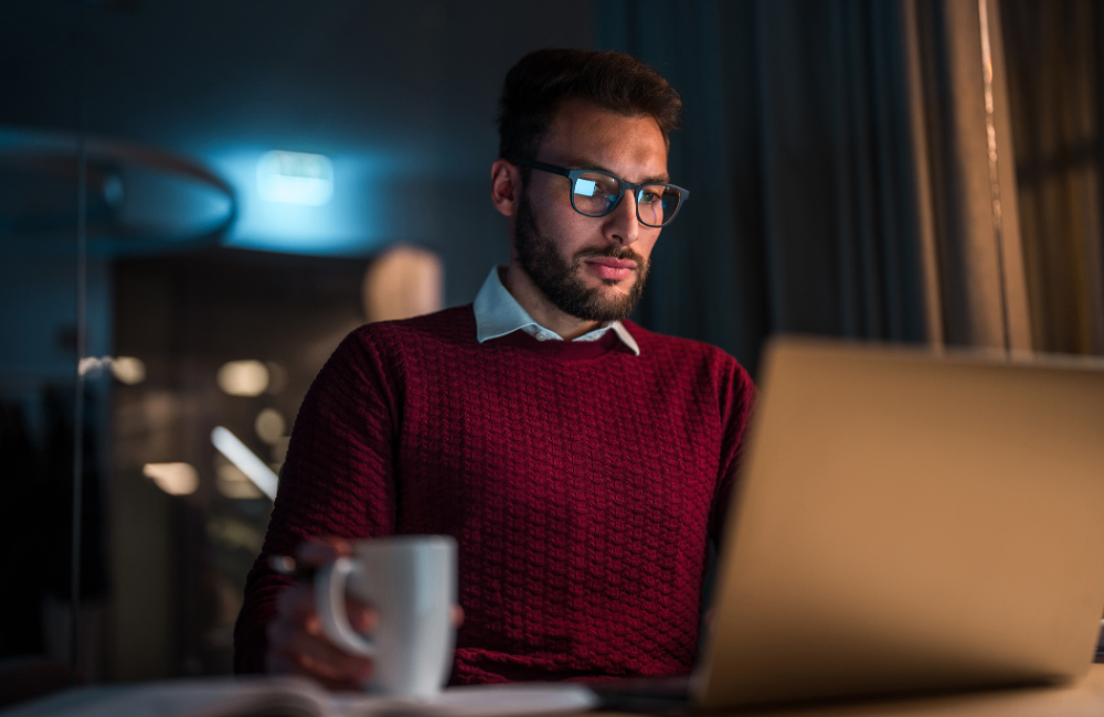 Product recruitment professional sitting at desk with laptop 