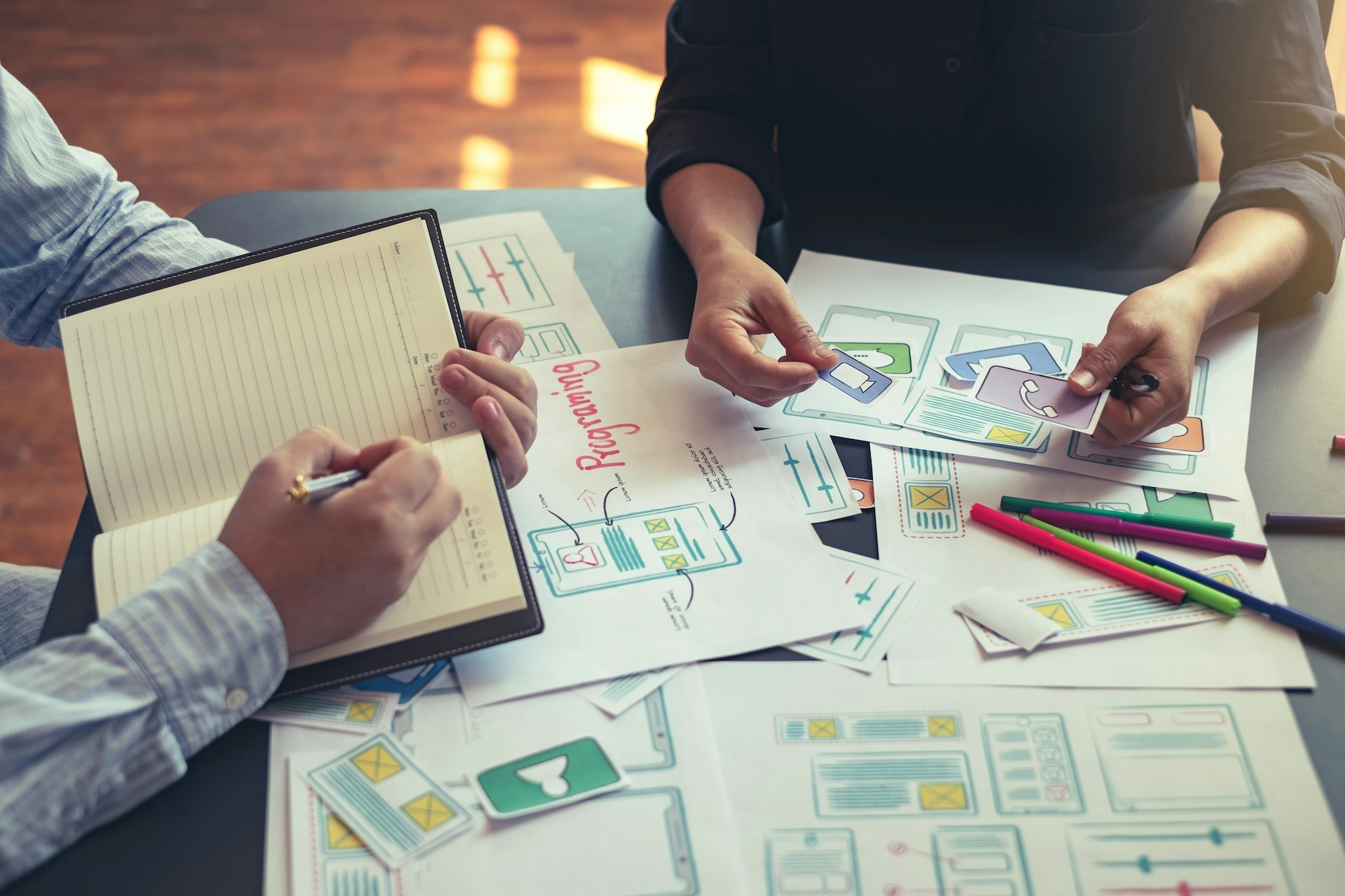 People making notes and creating strategy documents
