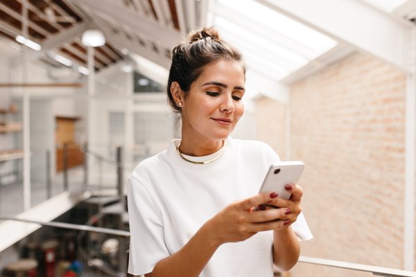 Performance marketer looking at salary data on phone