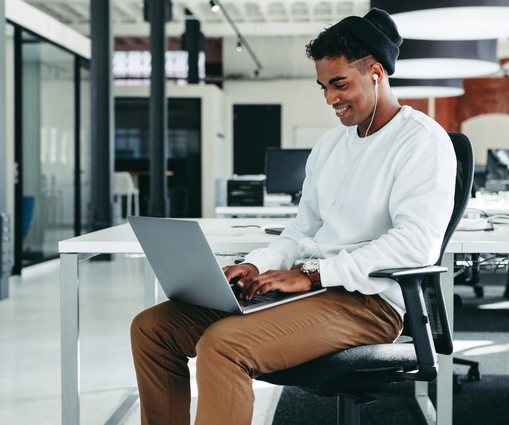 Software engineer looking at salary guide on laptop