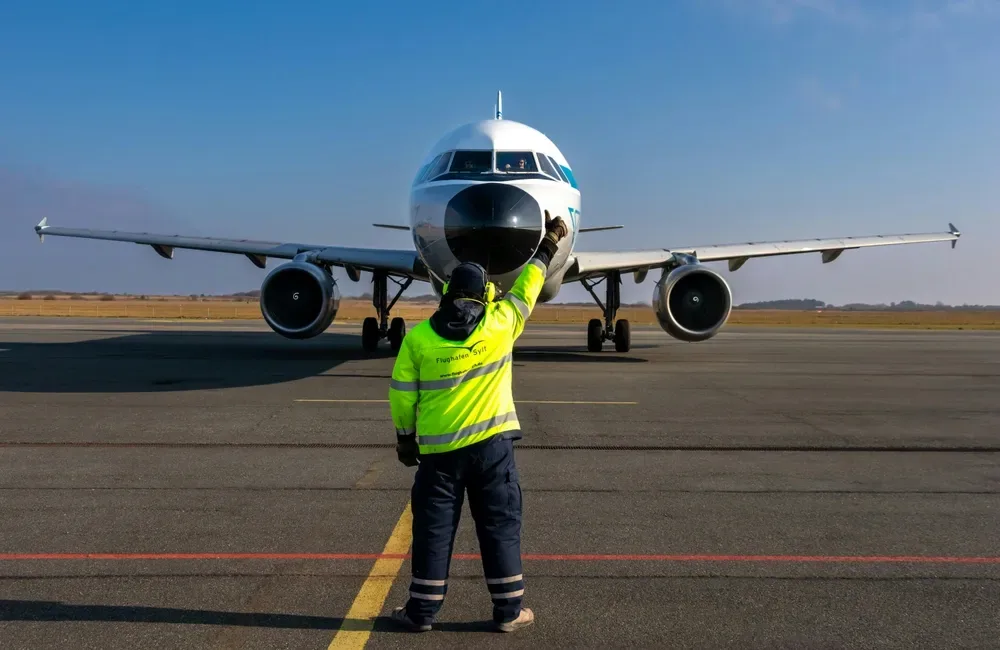 Man In Front of Plane