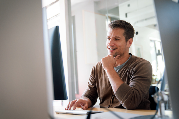 DevOps manager looking at 2026 salary data on computer