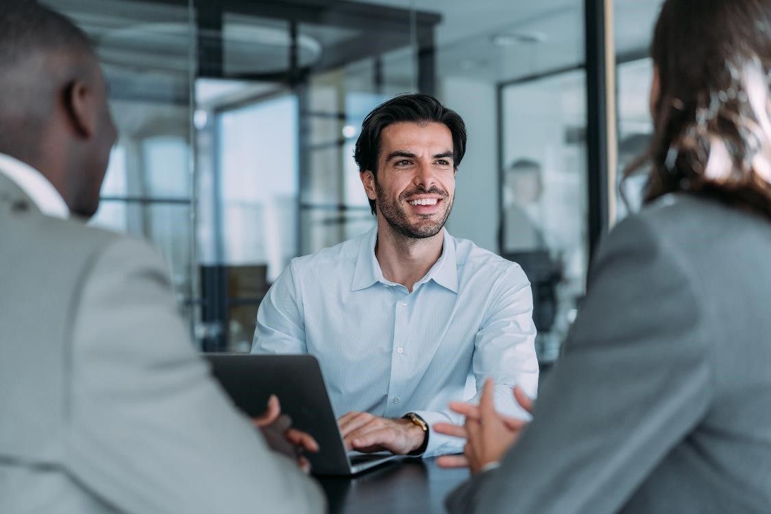 A smiling HR Assistant in a meeting