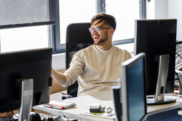 AI professional on computer looking at 2026 salary data
