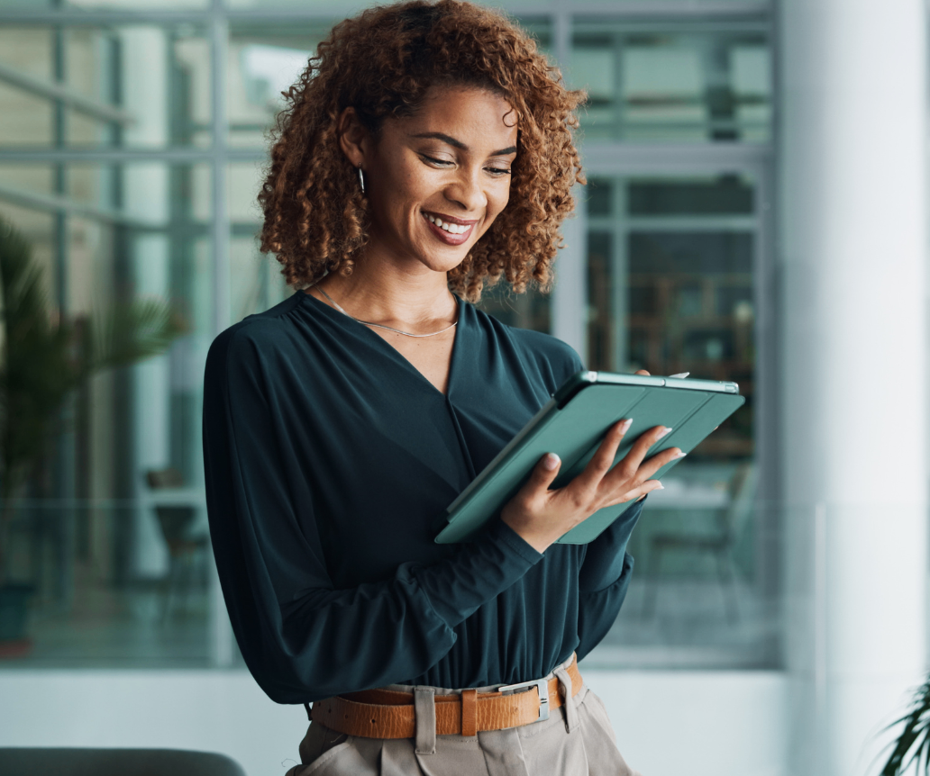 IT professional looking at 2026 salary data on tablet