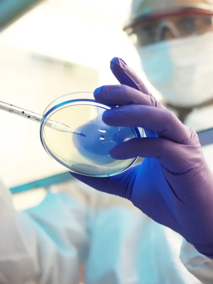 scientist with petri dish 