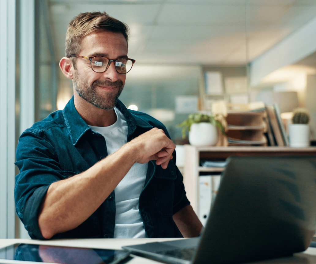 QA engineer looking at salary guide on laptop
