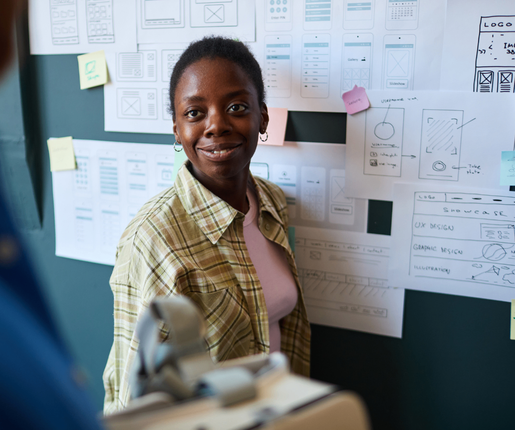 UX designer discussing wireframes with colleague