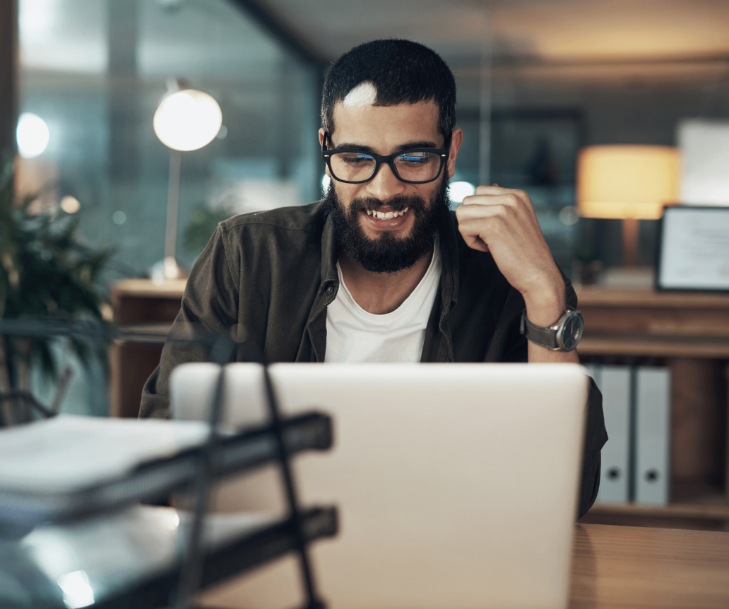 IT professional looking at 2026 salary data on laptop
