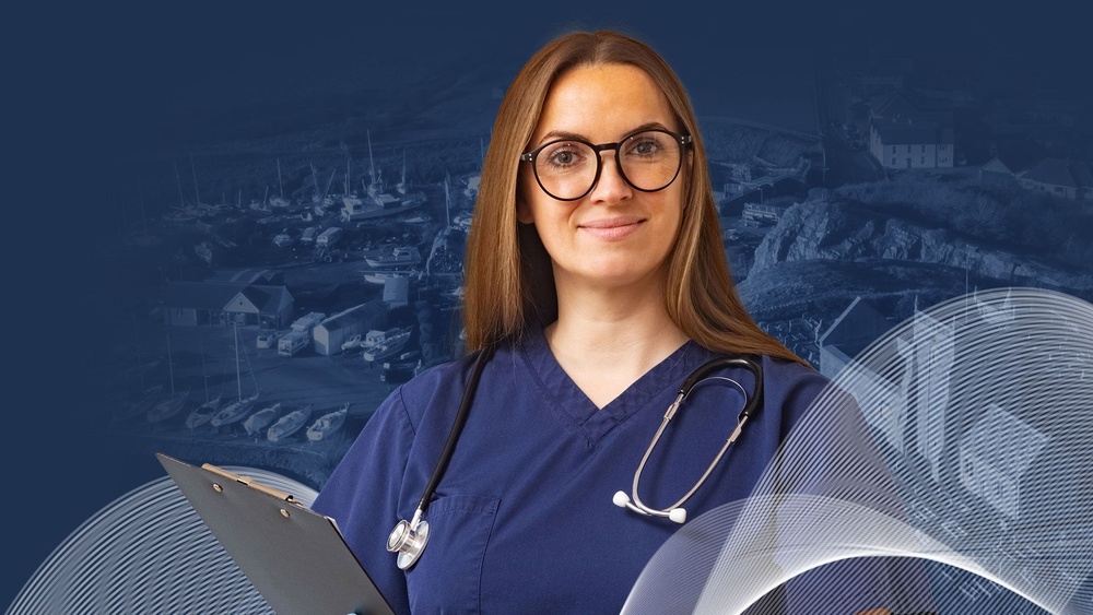 Global Medics' female Doctor in navy scrubs with stethoscope and holding clipboard