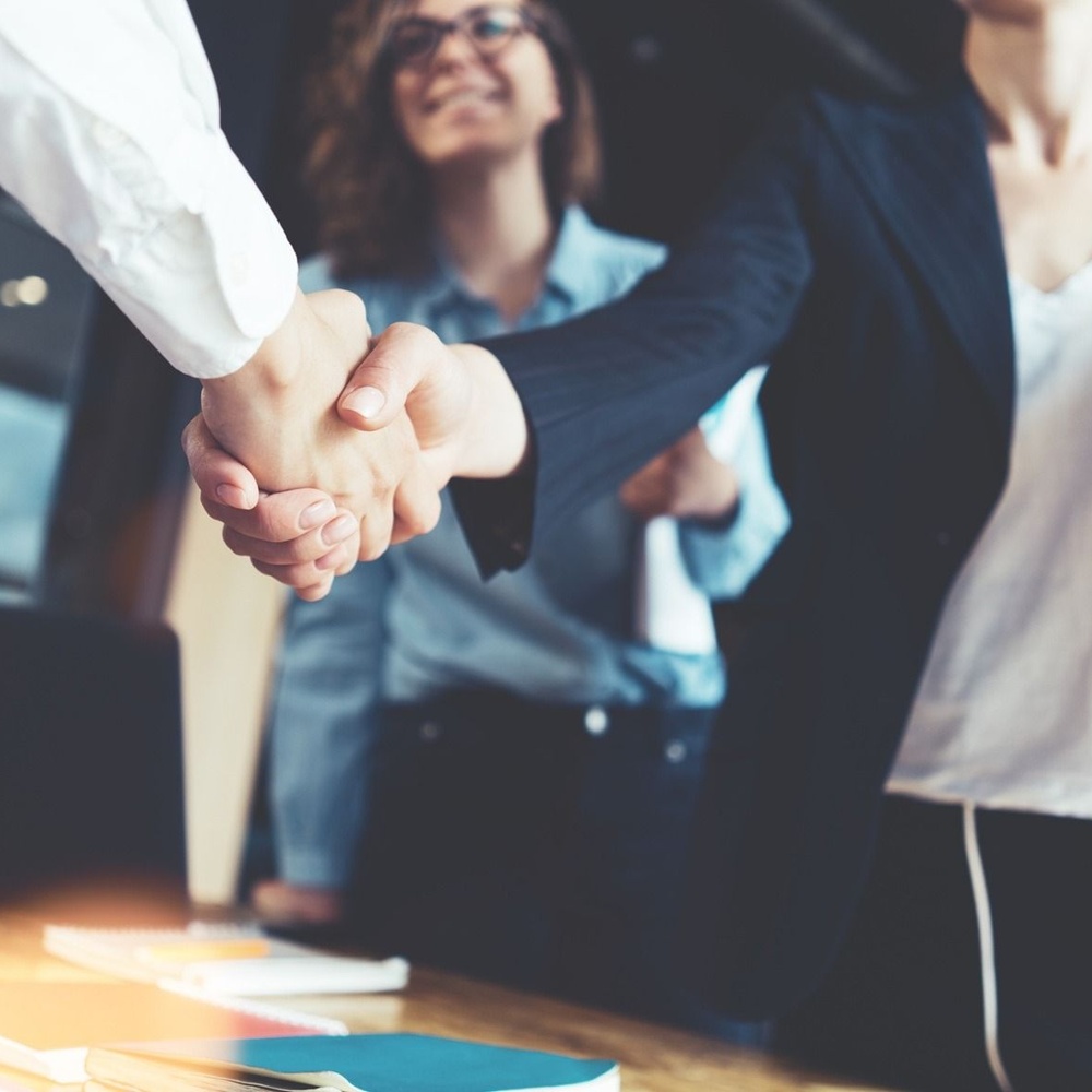 Shaking hands to complete sale