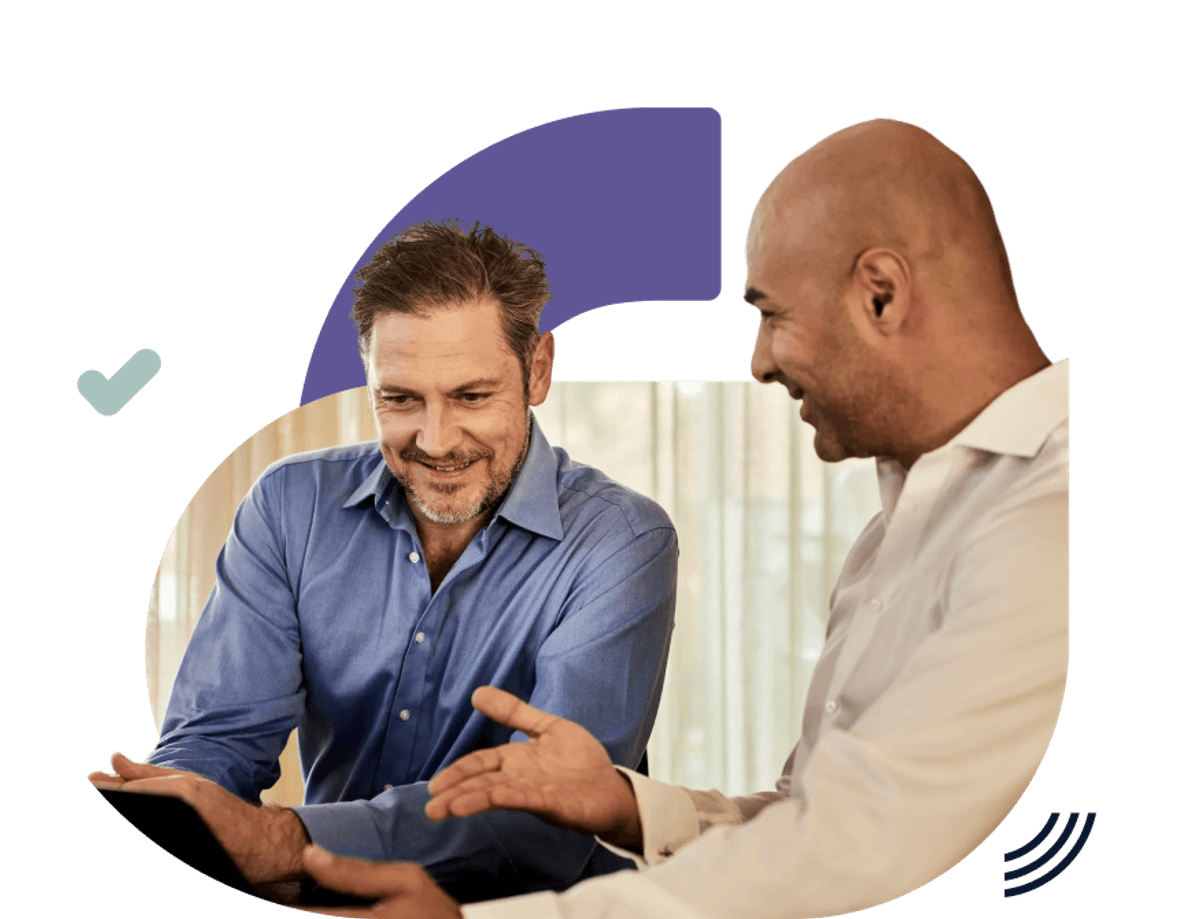 Two individuals sitting together in a conversation, with one gesturing while the other listens, set against a dark grid background with graphic design elements.