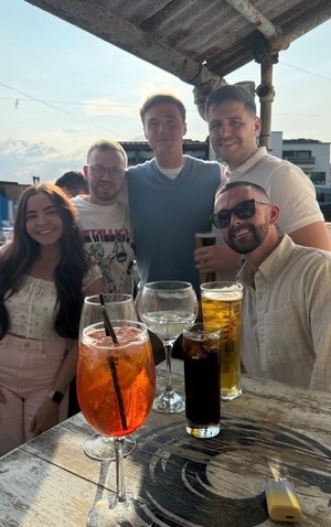 Colleagues gathered around for a social event