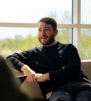 smiling man at a desk