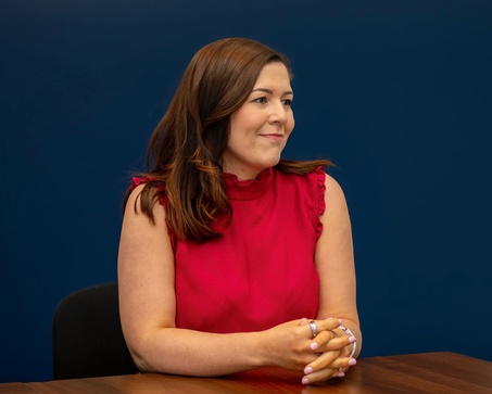 smiling recruiter holding a mug