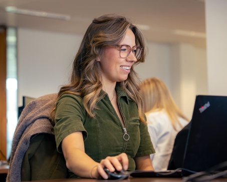 smiling woman at a computer