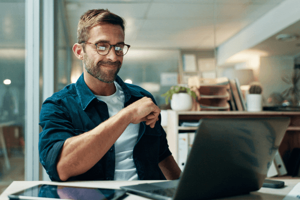 QA professional looking at salary data on laptop