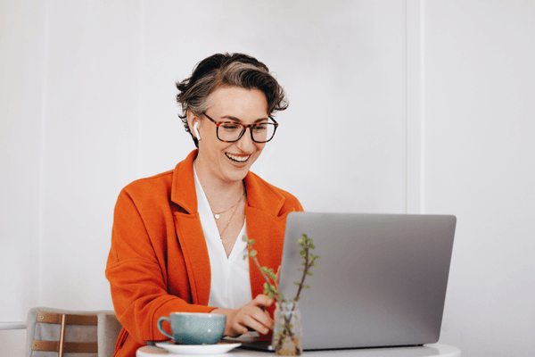 CS professional looking at 2026 salary data on laptop