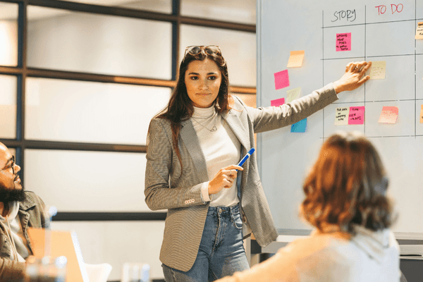 Project manager discussing 2026 salary data in team meeting