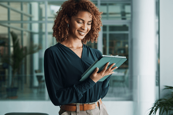 IT professional looking at 2026 salary data on tablet