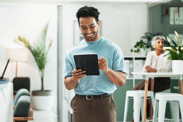 Tech professional looking at 2026 salary data on tablet