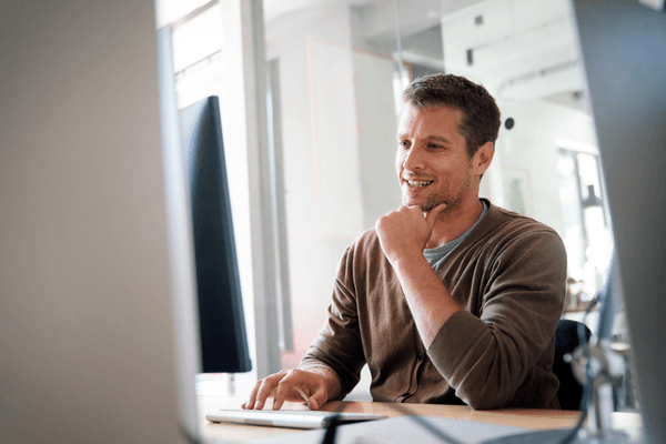 DevOps manager looking at 2026 salary data on computer