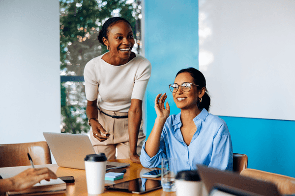 Client services team looking at 2026 salary data on laptop