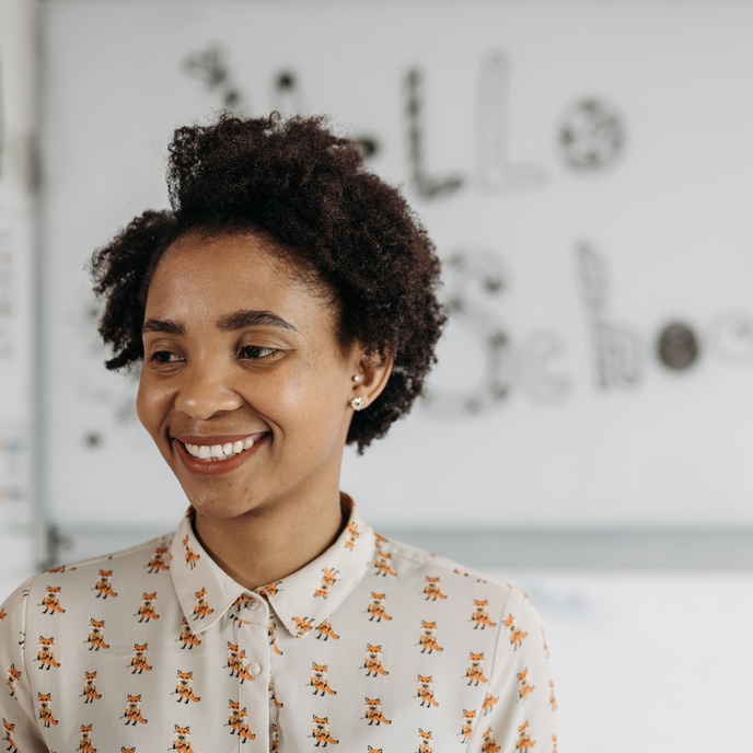 Female teacher in a classroom.