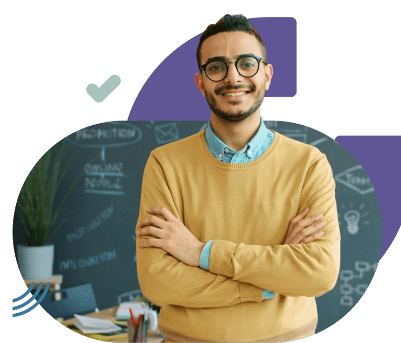 An individual standing with arms crossed in a workspace, with a chalkboard wall, desk items, and potted plant visible in the background, along with graphic design elements layered on the image.