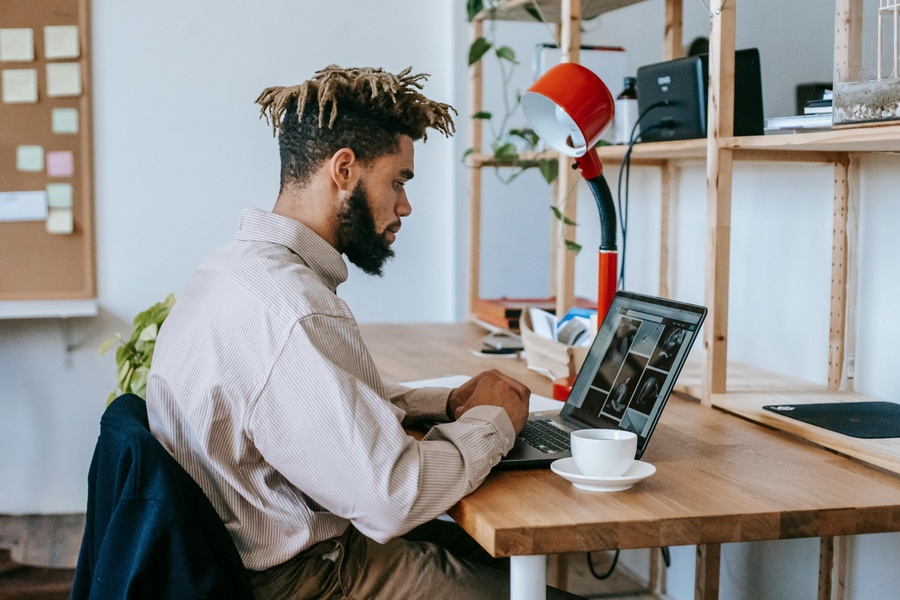 Person on a laptop in an office environment.