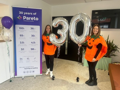 Pareto employees celebrate the Pareto 30th anniversary dressed up in Halloween costumes