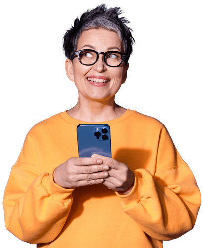 Healthcare Professional holding a smartphone and looking up with a friendly expression, representing easy communication and support.