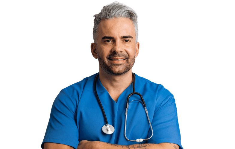 A confident medical professional in blue scrubs with a stethoscope stands against a modern cityscape, representing Medacs Healthcare’s global doctor recruitment.