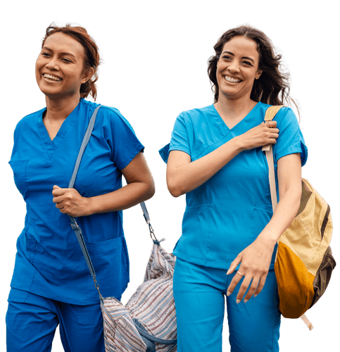 Two healthcare professionals in blue scrubs walking together with bags, representing teamwork, support and nursing care.