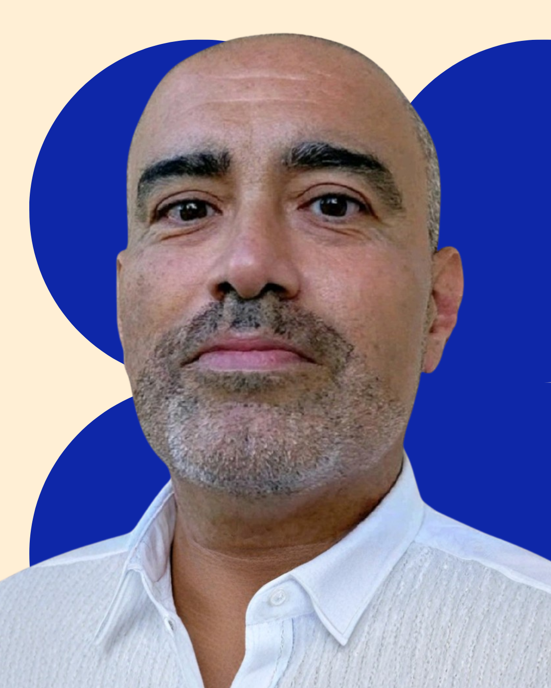 Headshot of Bill Bentaieb wearing a white button down shirt